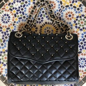 Purchased with a bulk lot of handbags.